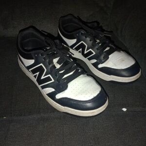 New Balance Men's Black and White Sneakers